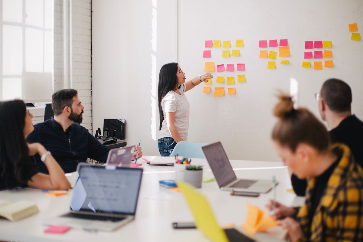 A strategy team collaborating in a bright workspace